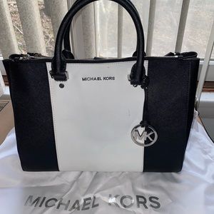 Black and white Michael Kors handbag
